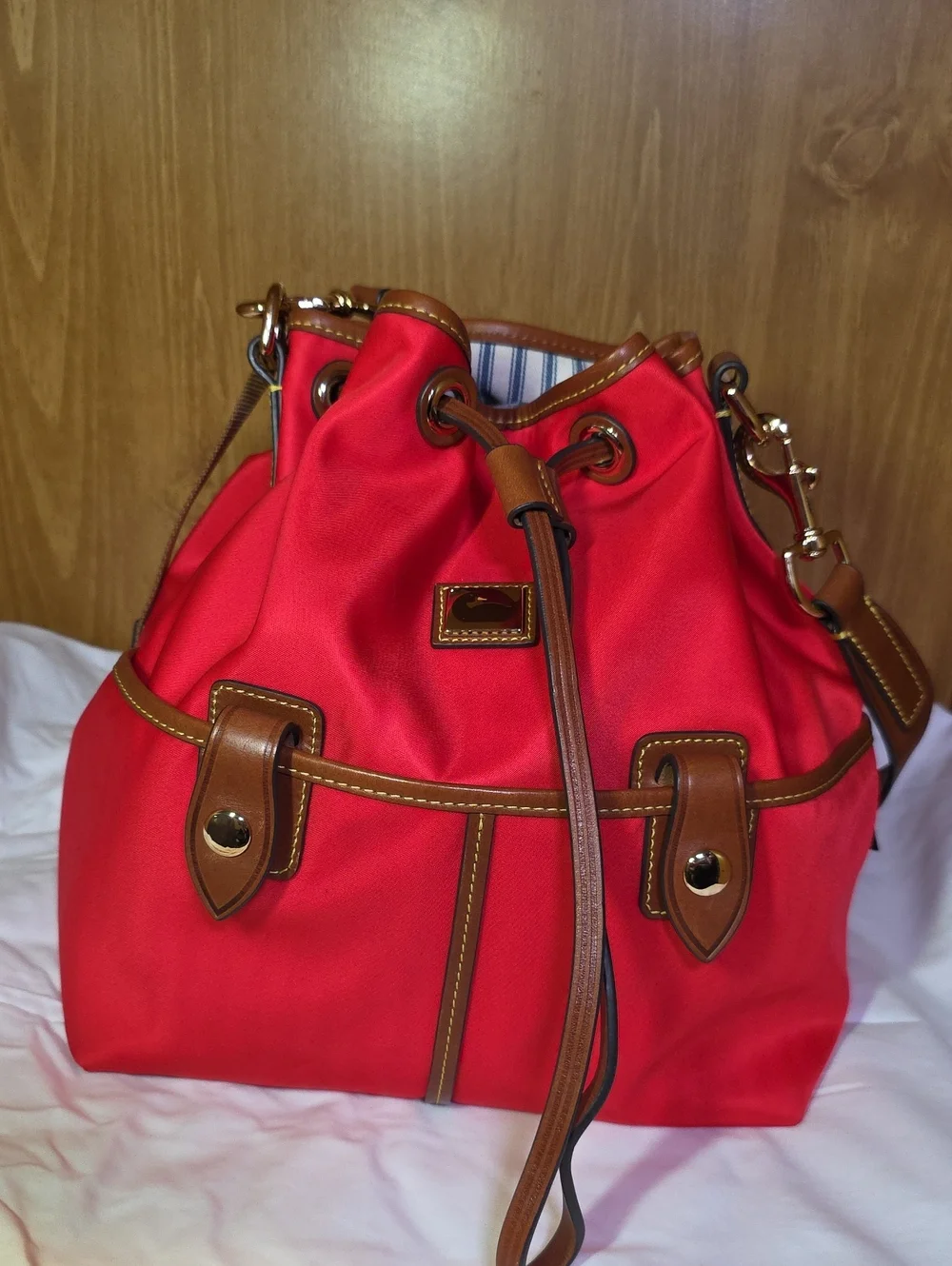 Dooney & Bourke Red Drawstring Bucket Bag with Brown Trim